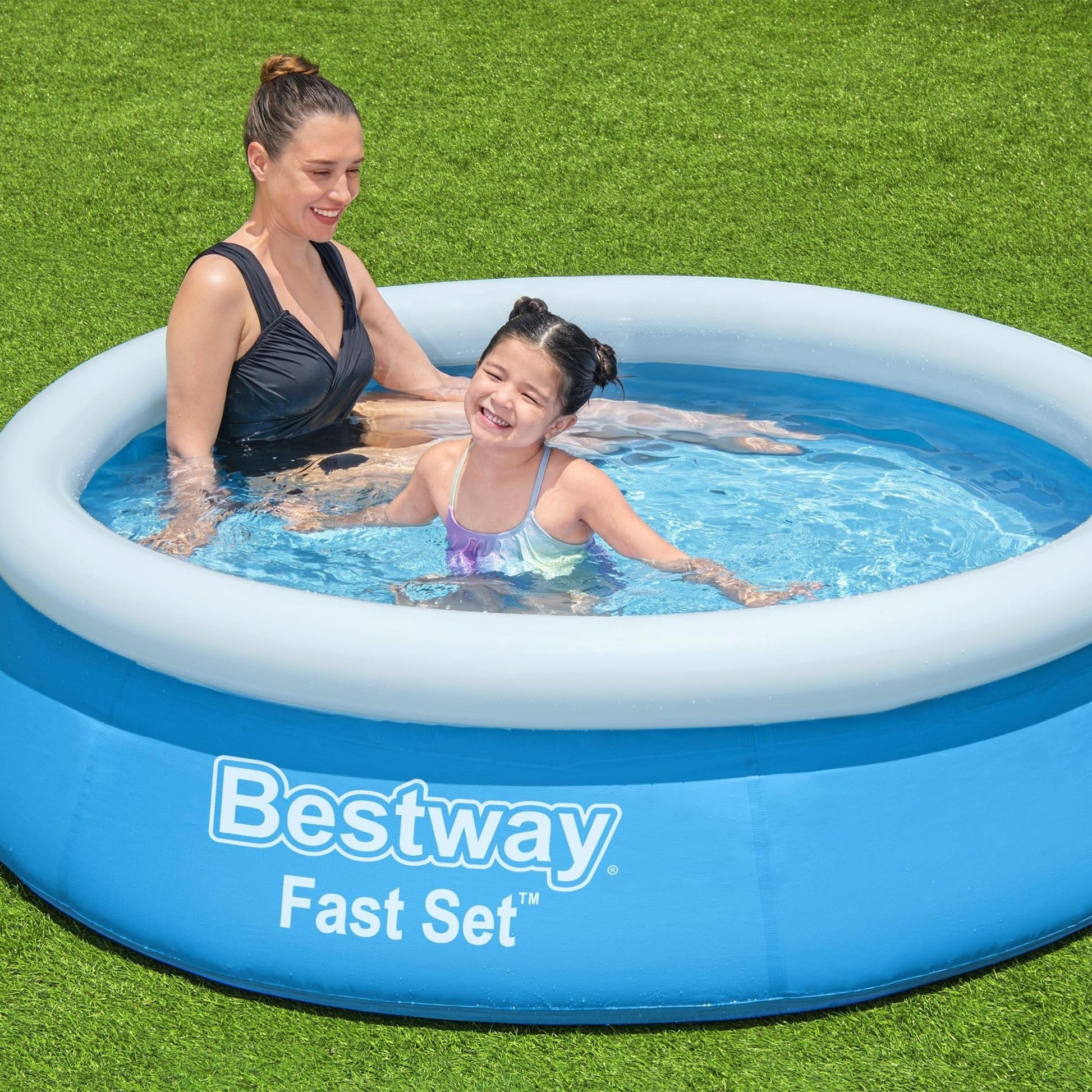 Blue Bestway 6ft by 20in round inflatable above ground pool set up outdoors with clear water and a fenced backyard background.