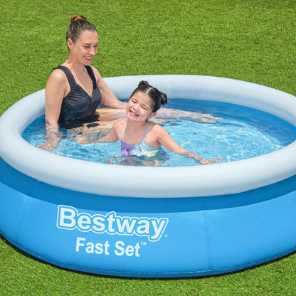Blue Bestway 6ft by 20in round inflatable above ground pool set up outdoors with clear water and a fenced backyard background.