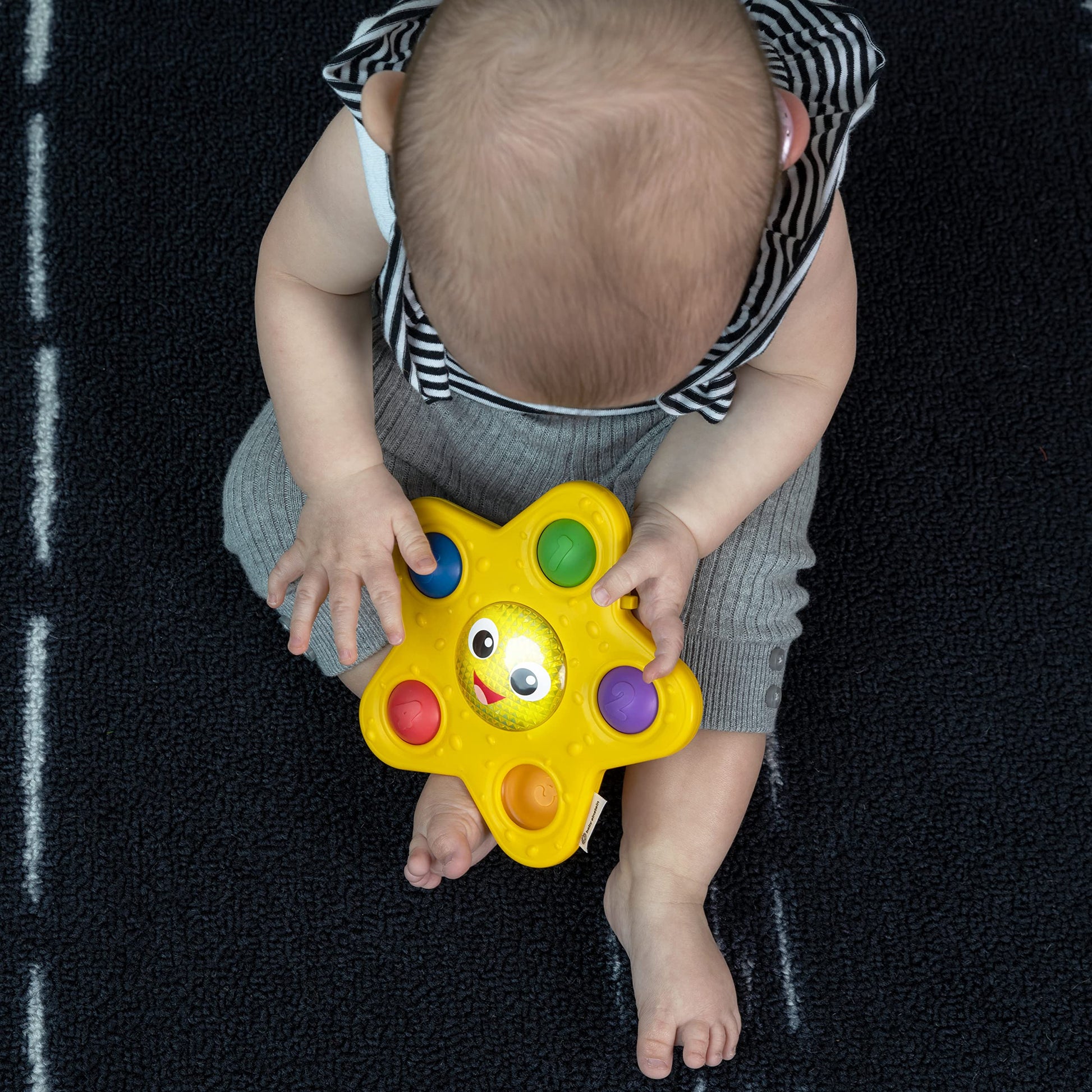 Baby Einstein Ocean Explorers starfish sensory popper toy with glowing lights, designed for babies 6 months and older.