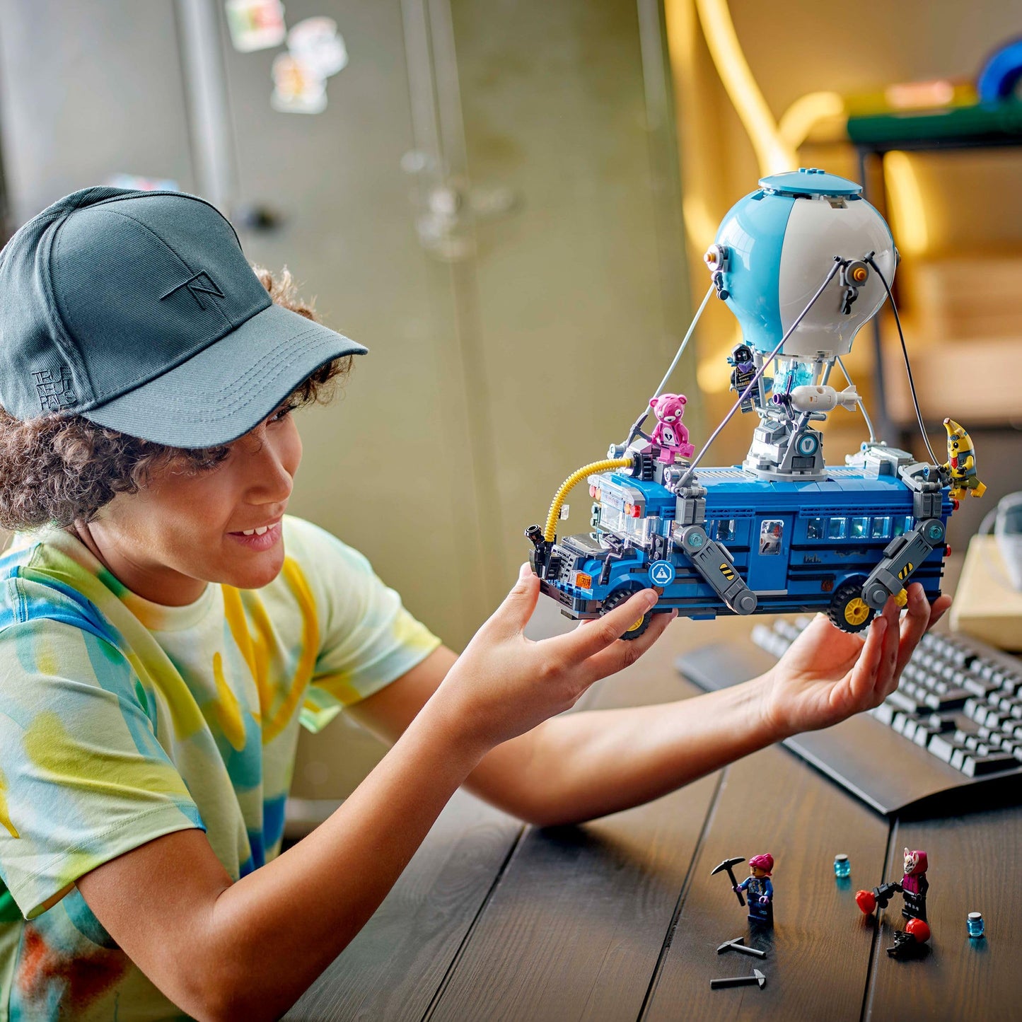 LEGO Fortnite Battle Bus model kit with 9 minifigures and accessories, showcasing vibrant details and gaming theme.