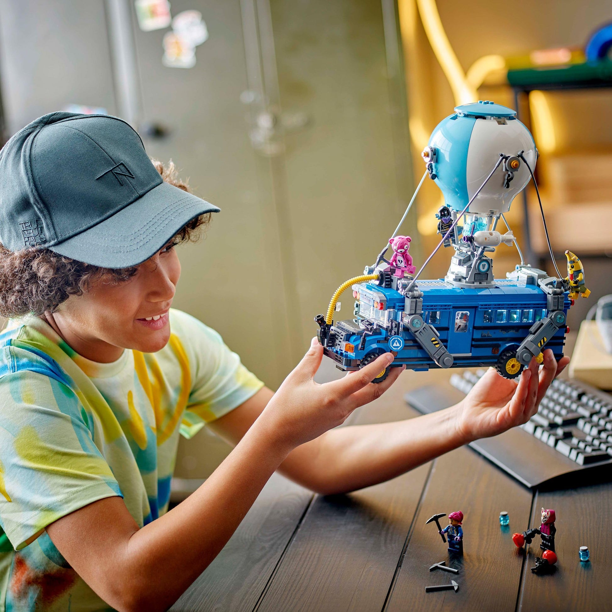 LEGO Fortnite Battle Bus model kit with 9 minifigures and accessories, showcasing vibrant details and gaming theme.
