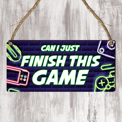 Wooden gamer plaque featuring gaming-themed decor with Xbox and PlayStation icons, ideal for game room wall decor.