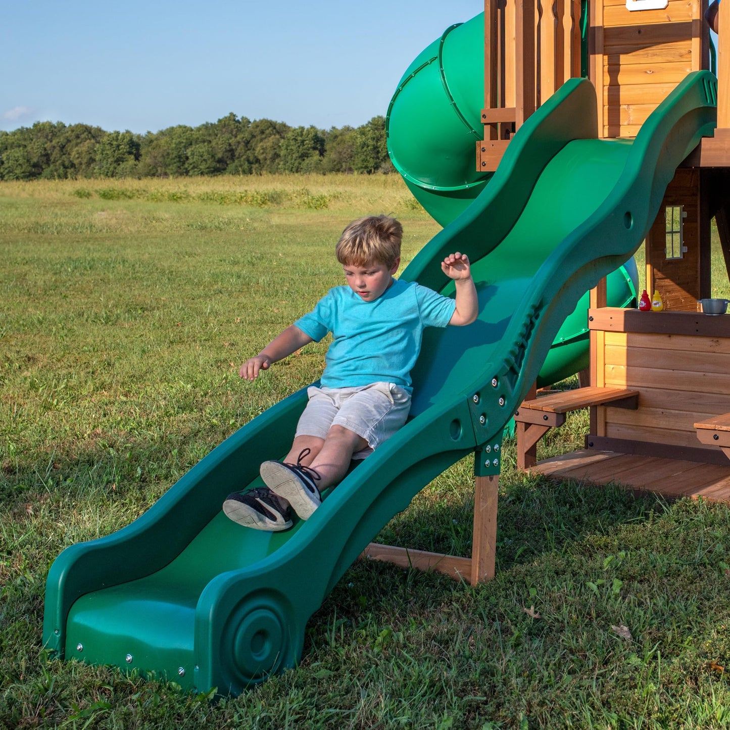 Backyard Discovery Cedar Cove cedar wood swing set with wave slide, tube slide, rock wall, web disc, and belt swings for kids outdoor play