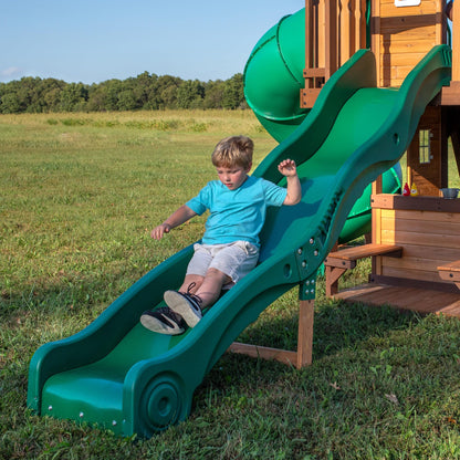 Backyard Discovery Cedar Cove cedar wood swing set with wave slide, tube slide, rock wall, web disc, and belt swings for kids outdoor play