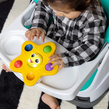 Baby Einstein Ocean Explorers Starfish sensory popper toy with glowing lights, designed for babies 6 months and up.