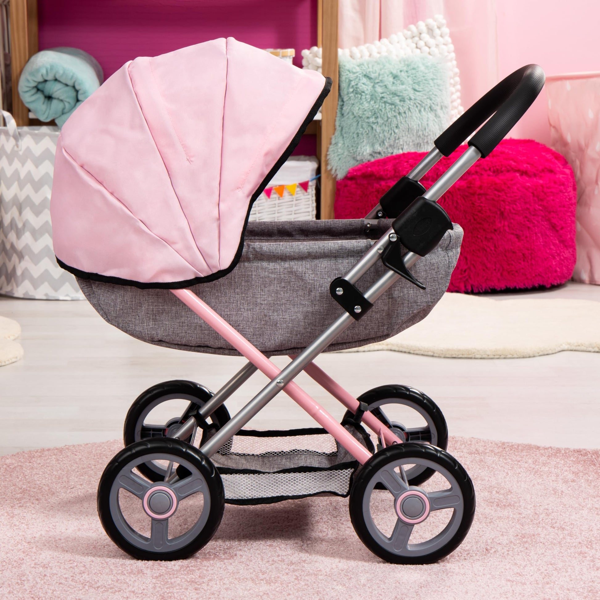 Bayer Cosy baby doll pram with large wheels, foldable design, storage basket, changing bag, and matching accessories for 46cm dolls.