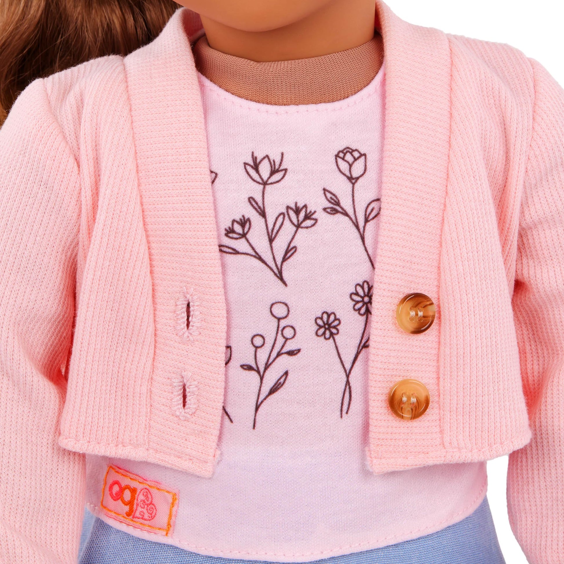 Our Generation 18-inch doll outfit featuring a pink sweater, blue skirt, and floral print top for pretend play.