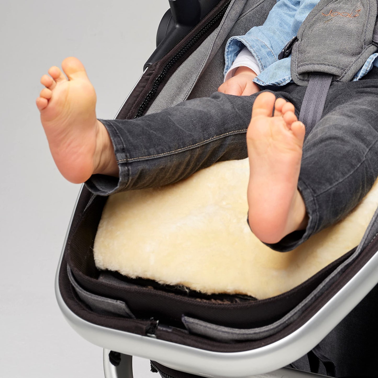 Naturally Sheepskins Merino pram liner with New Zealand sheepskin, cotton backing, breathable, temperature regulating, fits baby strollers.