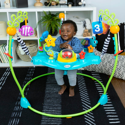 Baby Einstein Ocean Explorers Curiosity Cove 2-in-1 activity jumper and floor toy for babies 6-12 months, with colorful ocean-themed features.