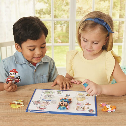 Aquabeads Paw Patrol keychain craft kit with colorful beads and accessories for creating themed keychains and jewelry.