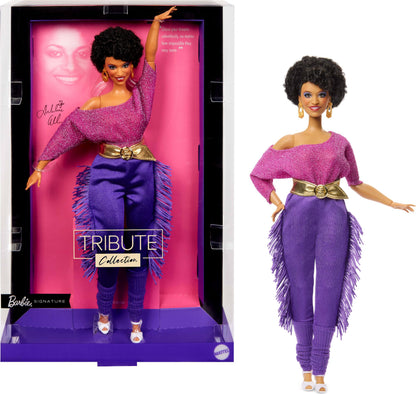Barbie Signature Debbie Allen Tribute Doll in off-shoulder top, gold belt, purple fringe pants, and leg warmers.