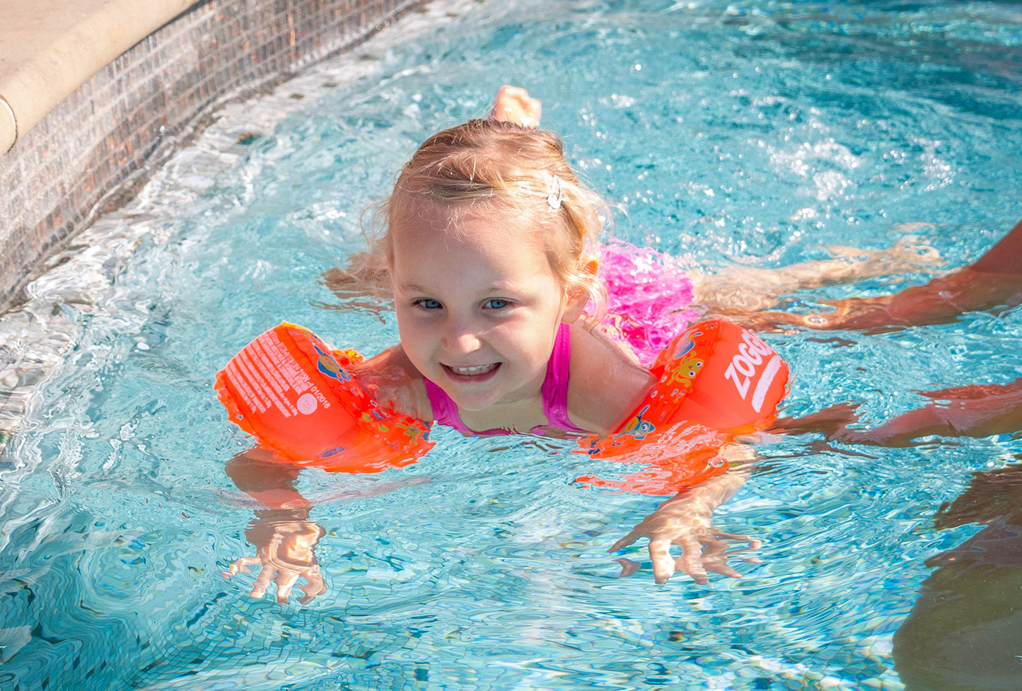 Zoggs orange and multi dual buoyancy arm rings for kids aged 1-6 years, perfect for swimming safety and fun.
