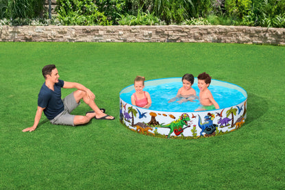 Bestway inflatable dinosaur paddling pool, 183cm x 38cm, set up in an outdoor garden for kids to play.