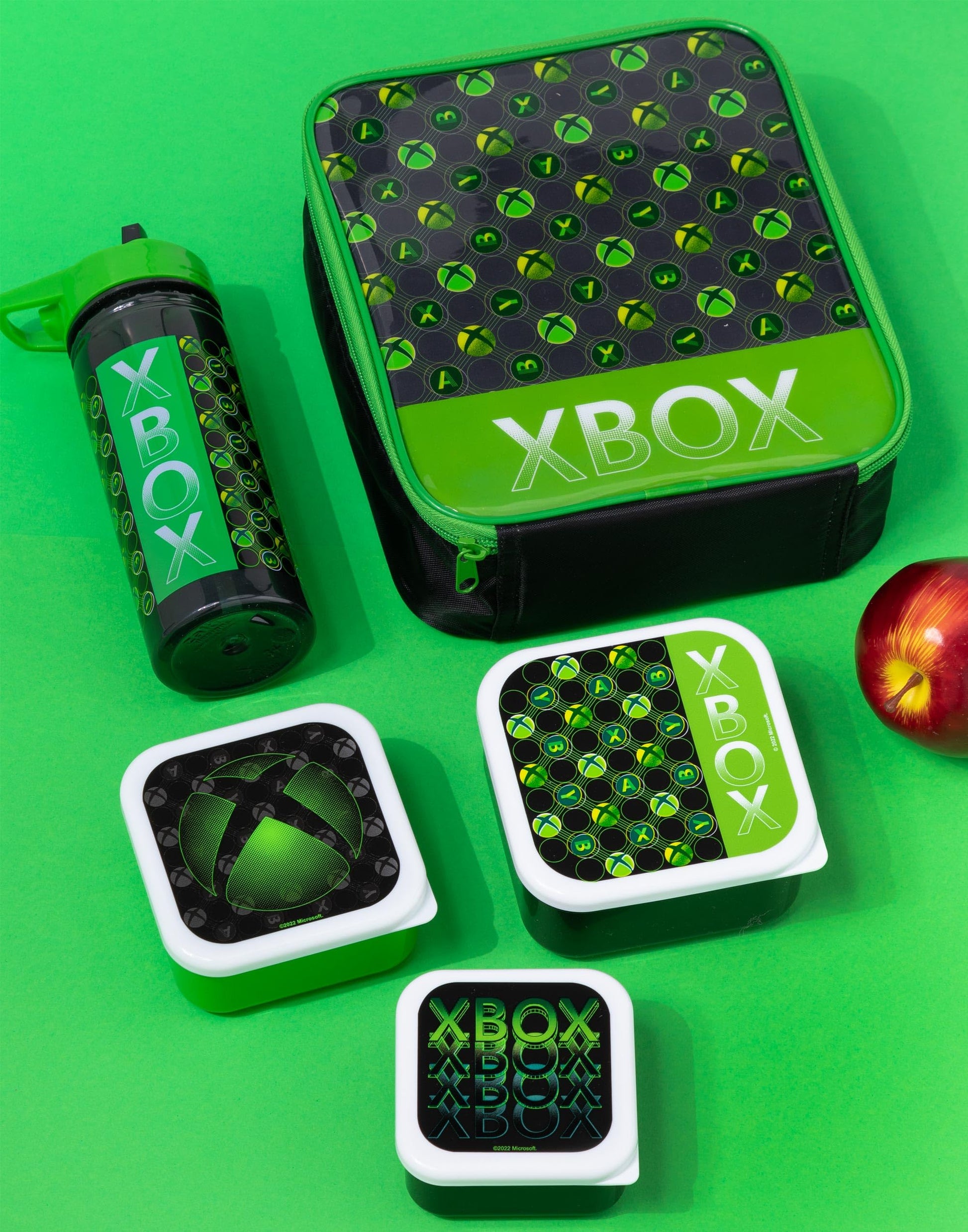 Green Xbox lunch bag for kids with game controller logo, includes water bottle and snack pots, BPA-free food containers.