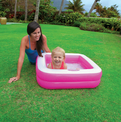 Intex inflatable square paddling pool, 86x86x25 cm, available in pink or lime green, perfect for outdoor summer fun.