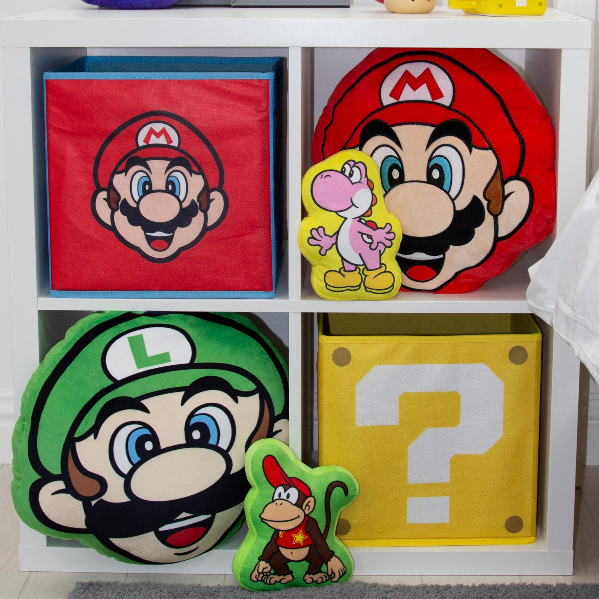 Nintendo Super Mario storage boxes by Character World, foldable cubes with Mario and Luigi faces, ideal for kids' rooms and playrooms.