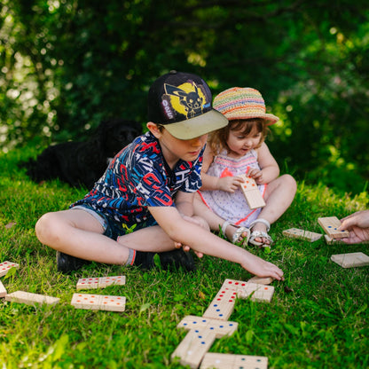 Wooden giant dominoes set by Jaques of London for kids, ideal for outdoor garden games and family fun.