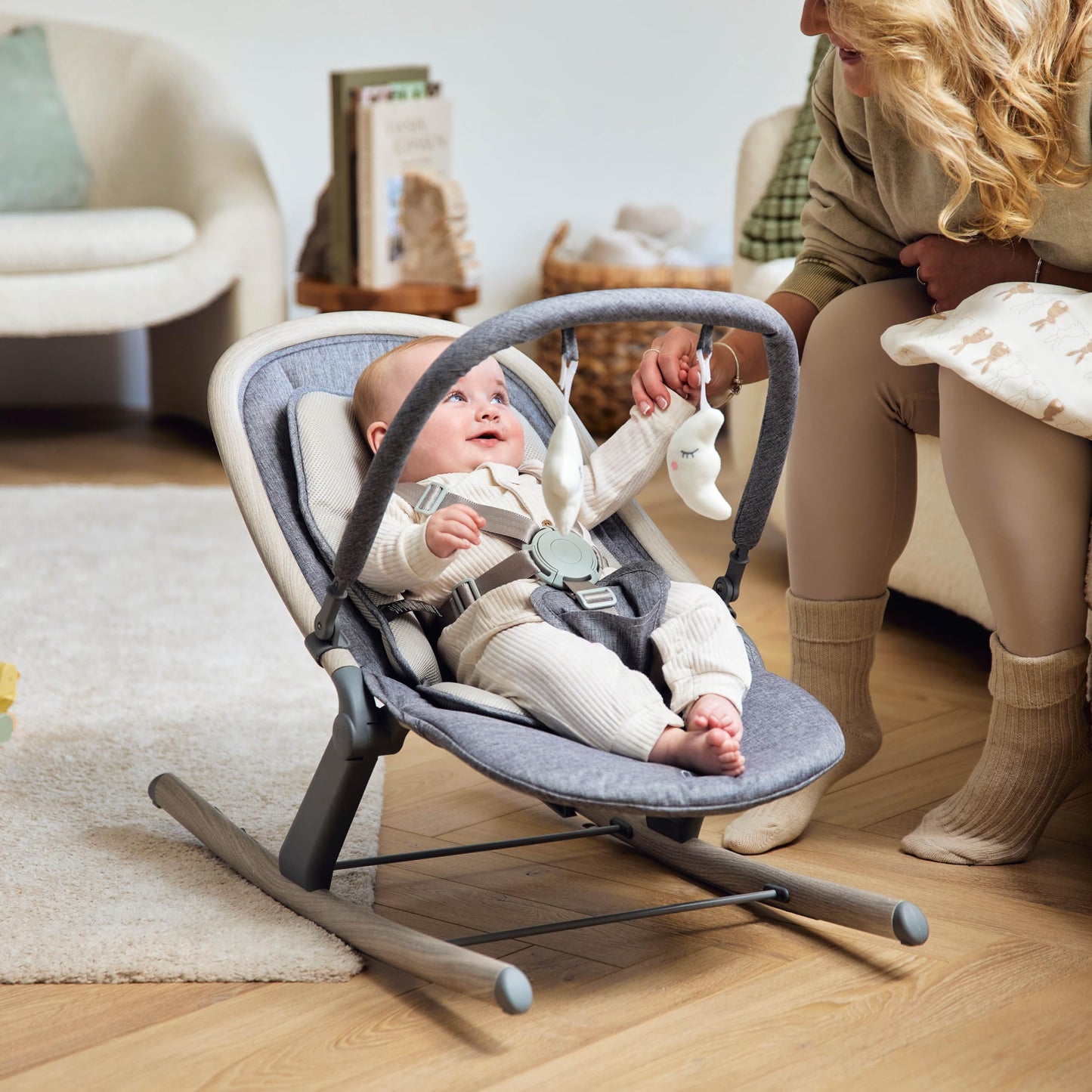 Ickle Bubba Stella baby bouncer and rocker with adjustable seat, lightweight frame, removable toy bar, washable fabric, suitable from birth.