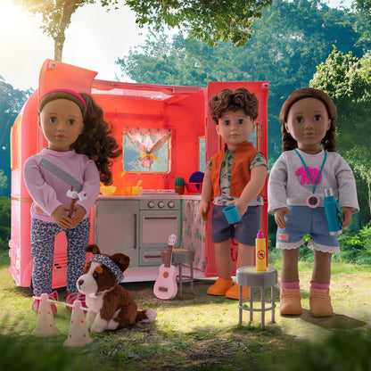 Our Generation pink camping trailer with kitchen and cooking accessories for 18-inch dolls, ideal for pretend play.