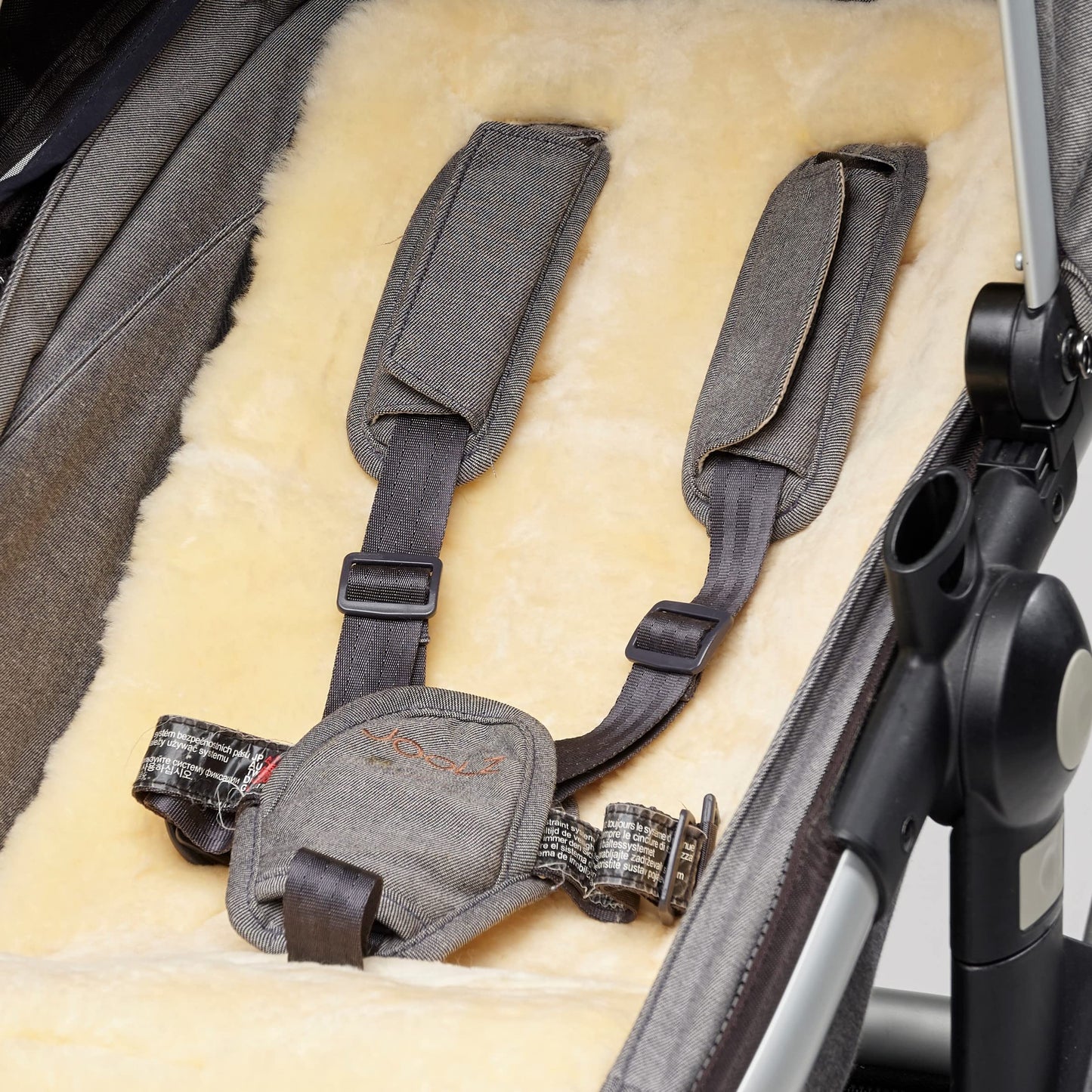 Naturally Sheepskins Merino pram liner with natural New Zealand sheepskin and cotton backing, breathable, temperature regulating baby stroller liner