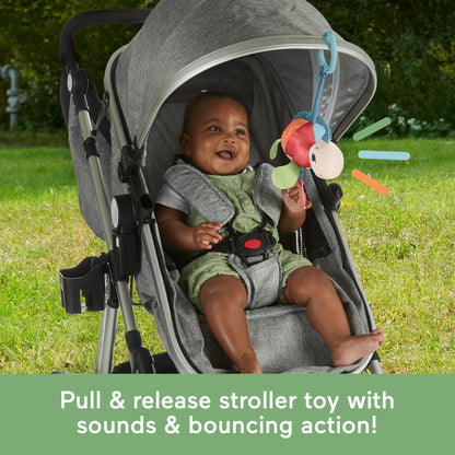 Fisher-Price Baby Stroller Toy Planet Friends Sea Me Bounce Turtle with teether, bouncing motion, and sounds for newborns.