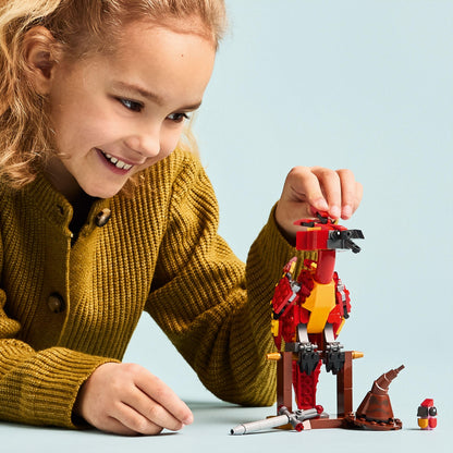 LEGO Harry Potter Fawkes figure with Sorting Hat and Sword of Gryffindor, depicting Dumbledore's Phoenix toy.