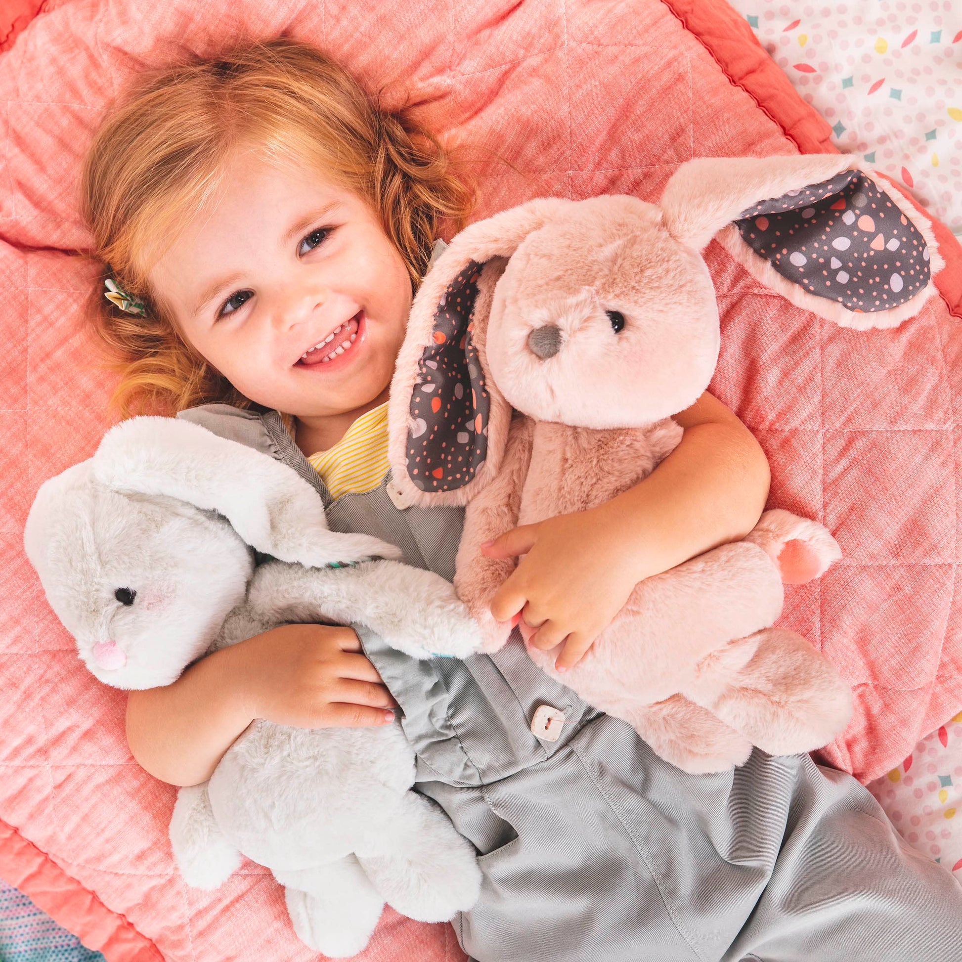 Pink plush bunny toy from B. toys, 12-inch huggable stuffed animal with soft, washable fabric for newborns and toddlers.
