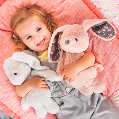 Pink plush bunny toy from B. toys, 12-inch huggable stuffed animal with soft, washable fabric for newborns and toddlers.