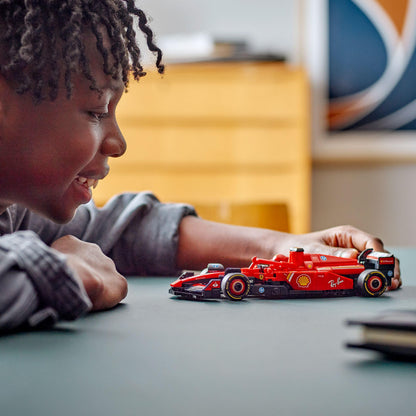 LEGO Speed Champions Ferrari SF-24 F1 race car model kit with a Formula 1 driver minifigure on display.