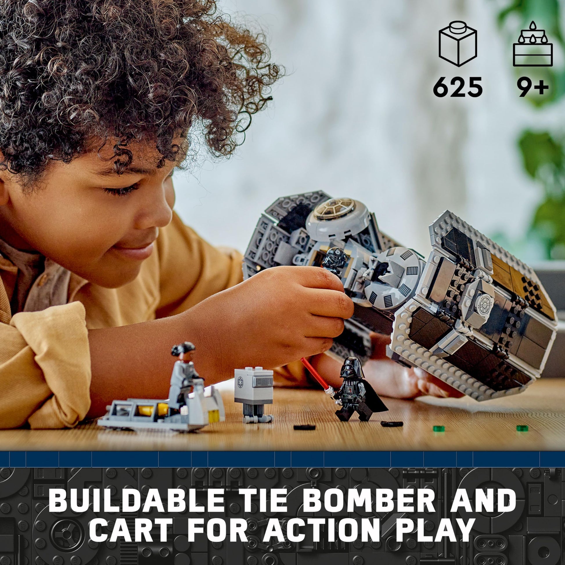 LEGO Star Wars 75347 TIE Bomber model with Gonk Droid and Darth Vader minifigure holding a lightsaber, showcasing torpedo function.