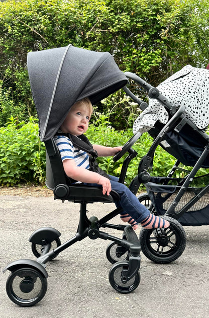 Roma Side Rider Universal Buggy Board with Seat - 4-Wheel Pram Board for Toddlers, Side Buggy Board with Universal Connector for Easy Attachment - Toy Steering Wheel - Hood