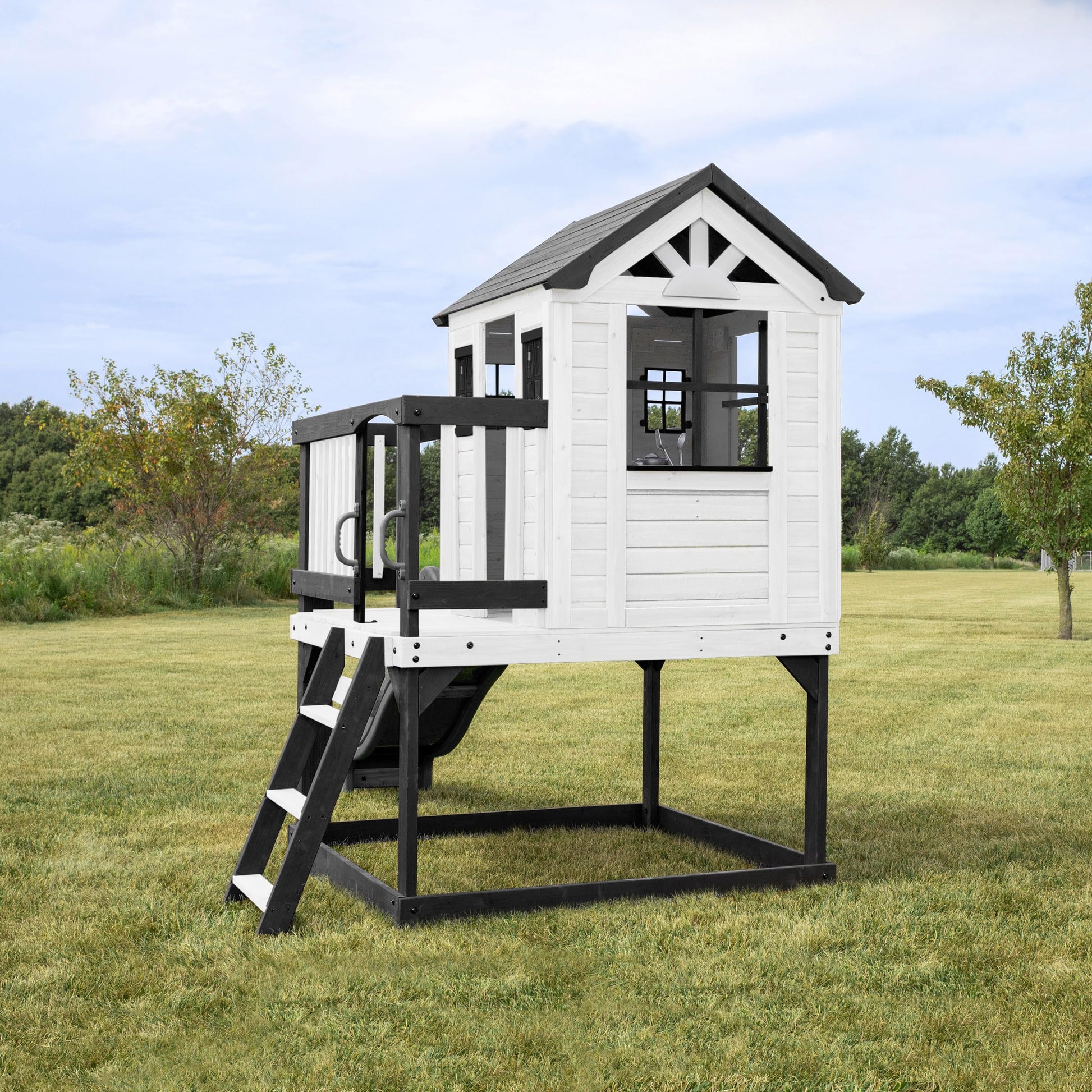 Backyard Discovery Sweetwater Heights cedar wood elevated playhouse with wave slide, toy kitchen, and growth chart for kids outdoor fun.