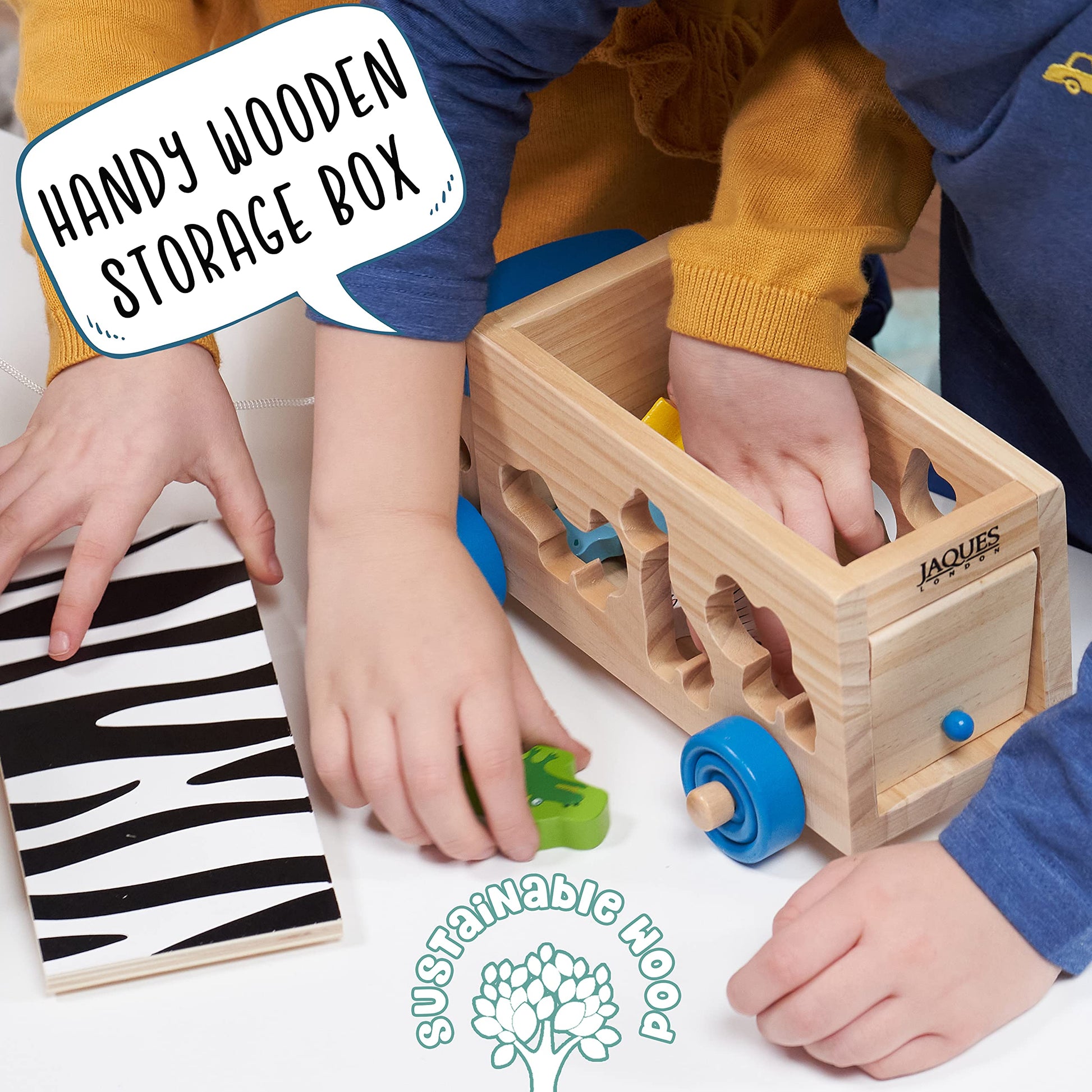 Wooden shape sorter toy by Jaques of London featuring a safari bus and animal shapes for toddlers aged 1 to 3 years.