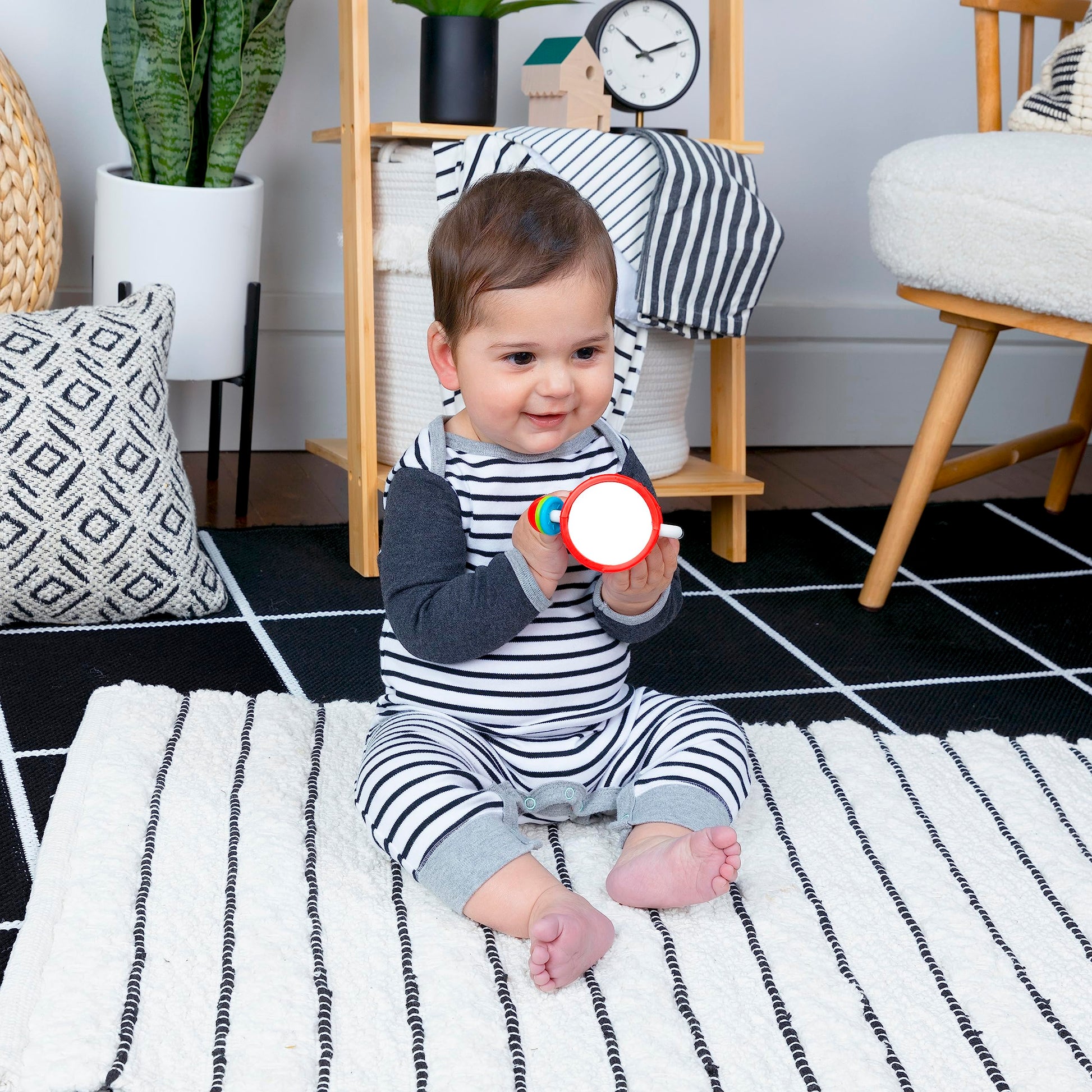 Baby Einstein Cal’s Sensory Shake-up rattle toy for infants, BPA-free, with colorful design and textured surfaces for sensory development.