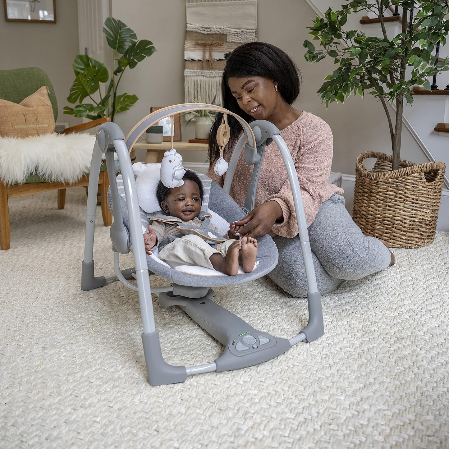 Ingenuity Swing 'n Go Deluxe baby swing with cushioned harness, plush toys, sounds, foldable design, suitable for 0-9 months.