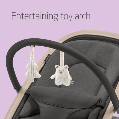 Maxi-Cosi Kori 2-in-1 ergonomic baby bouncer chair with toy arch, adjustable recline, harness, lightweight design, and newborn pillow.