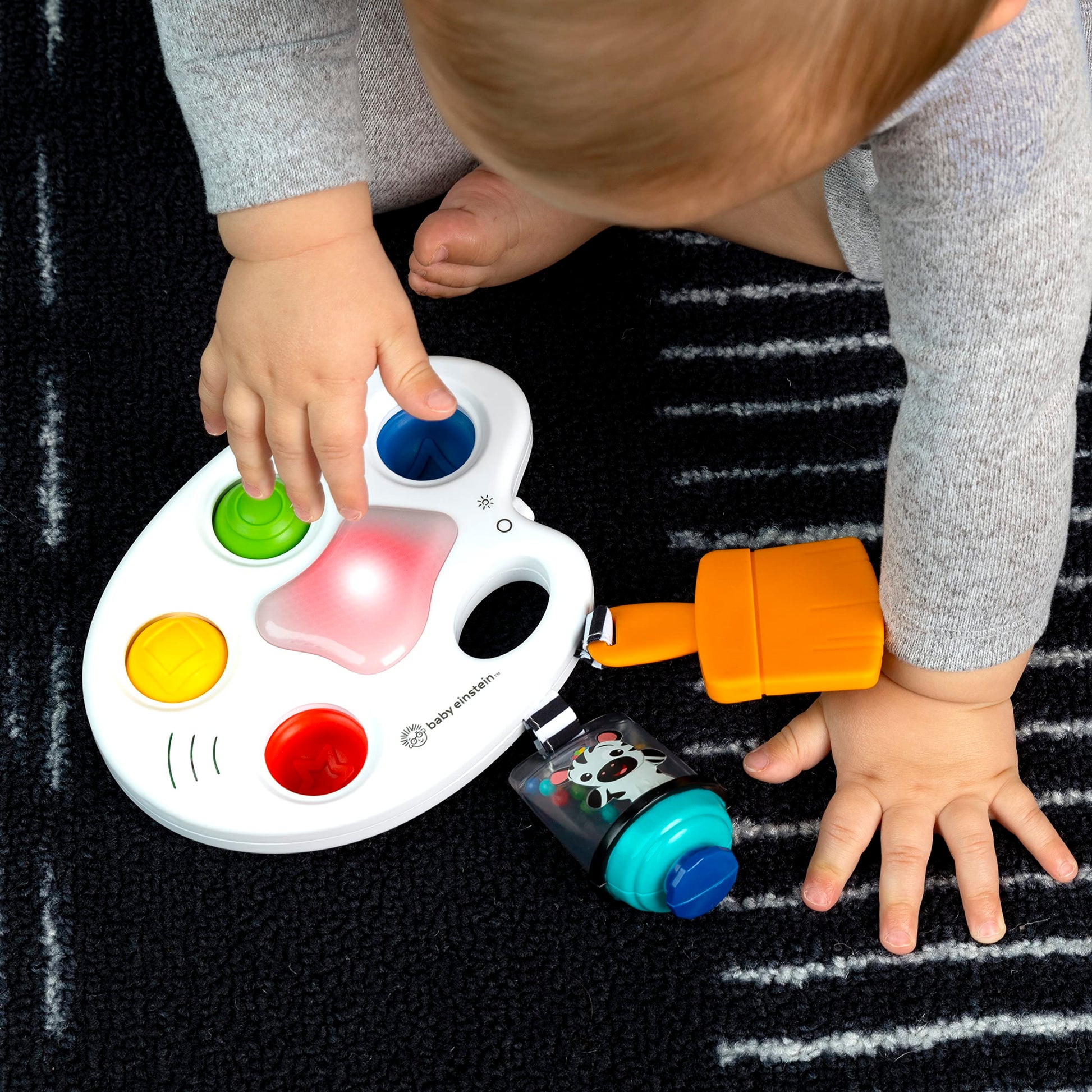 Baby Einstein Color Palette Popper sensory fidget toy for infants 6 months and up, featuring colorful poppers and textured surfaces.