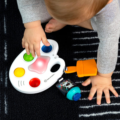 Baby Einstein Color Palette Popper sensory fidget toy for infants 6 months and up, featuring colorful poppers and textured surfaces.