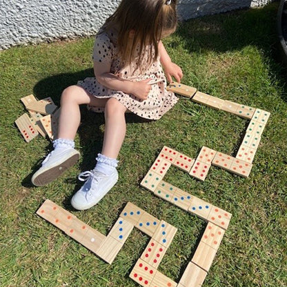 Wooden giant dominoes set by Jaques of London for kids, outdoor garden game with large, colorful domino pieces for children.