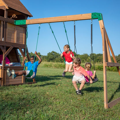 Backyard Discovery Cedar Cove cedar wood swing set with wave slide, tube slide, climbing rock wall, web disc, and belt swings for kids.