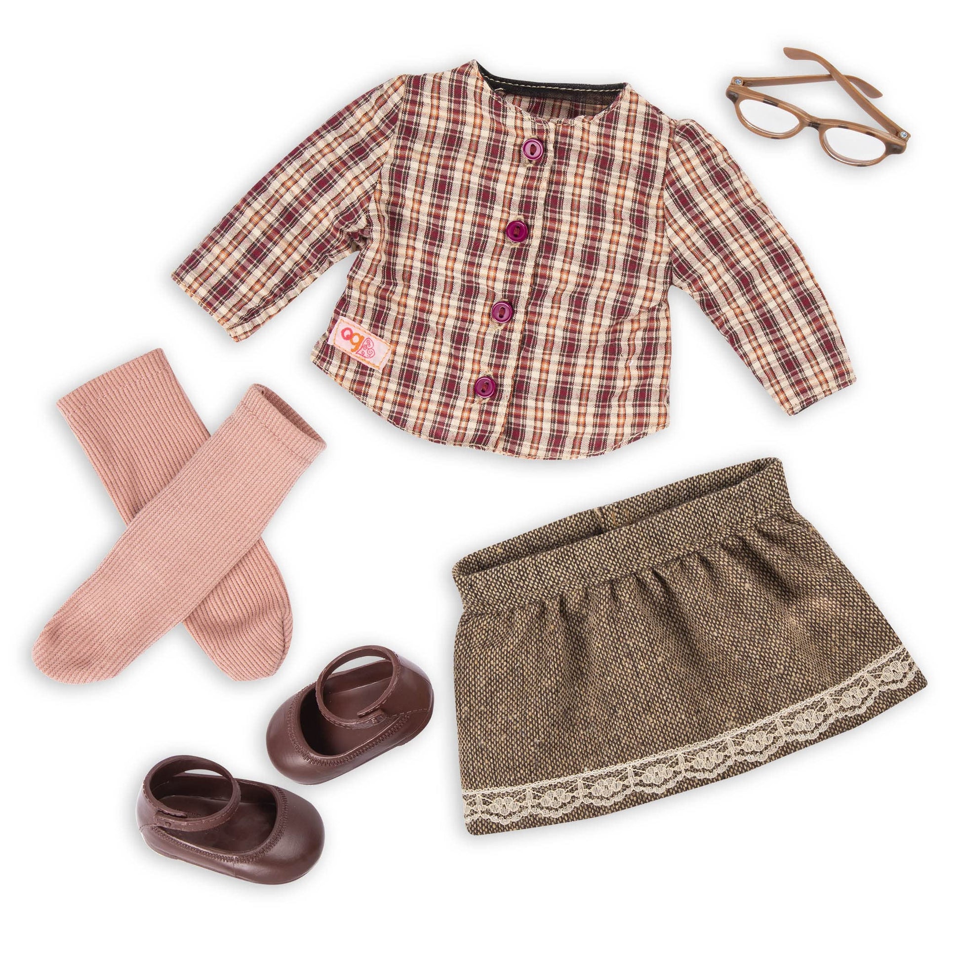 Our Generation April Doll with long red hair, dressed in a 6-piece outfit, perfect for imaginative play and adventures.