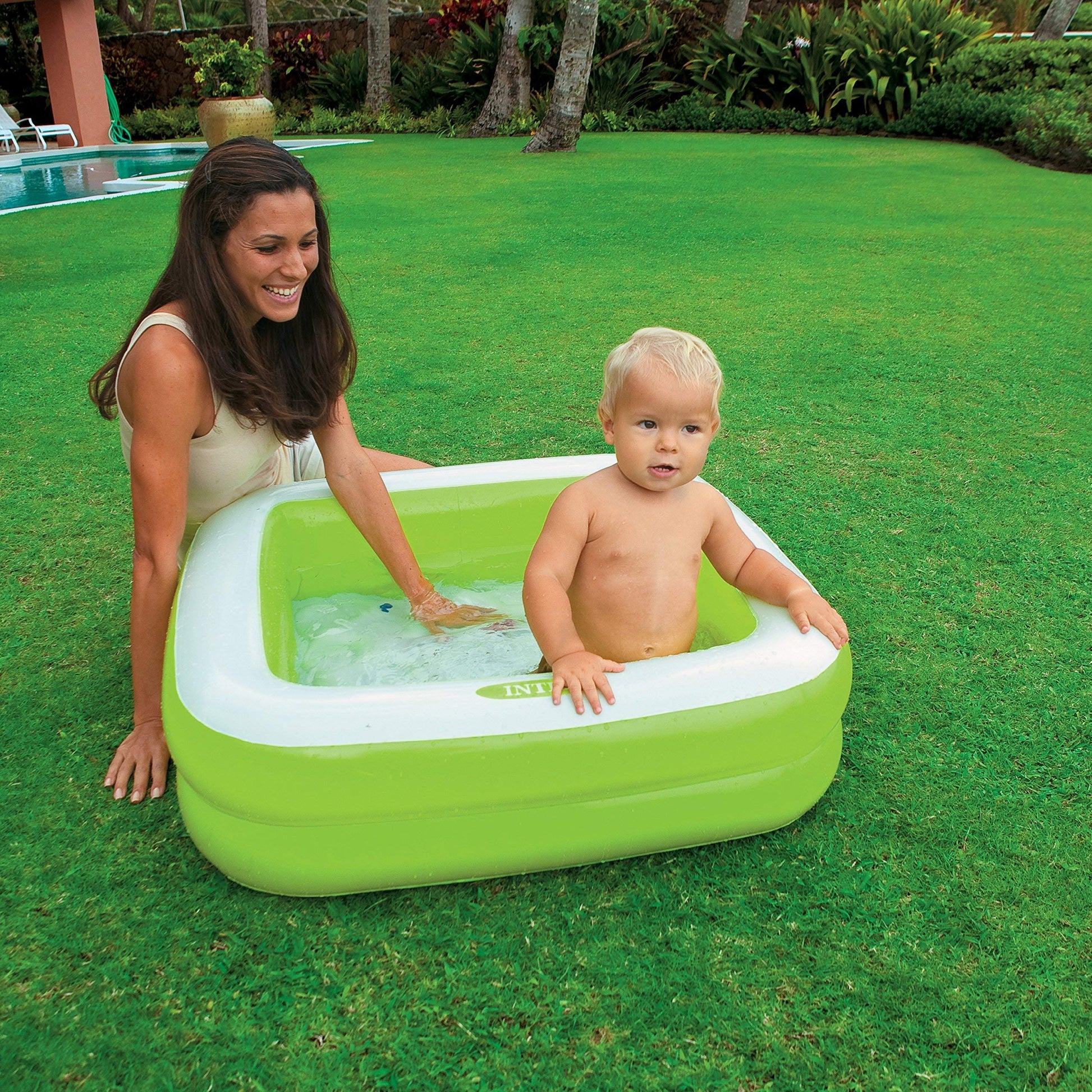 Intex inflatable square paddling pool in pink or lime green, measuring 86x86x25 cm, ideal for kids' summer fun.