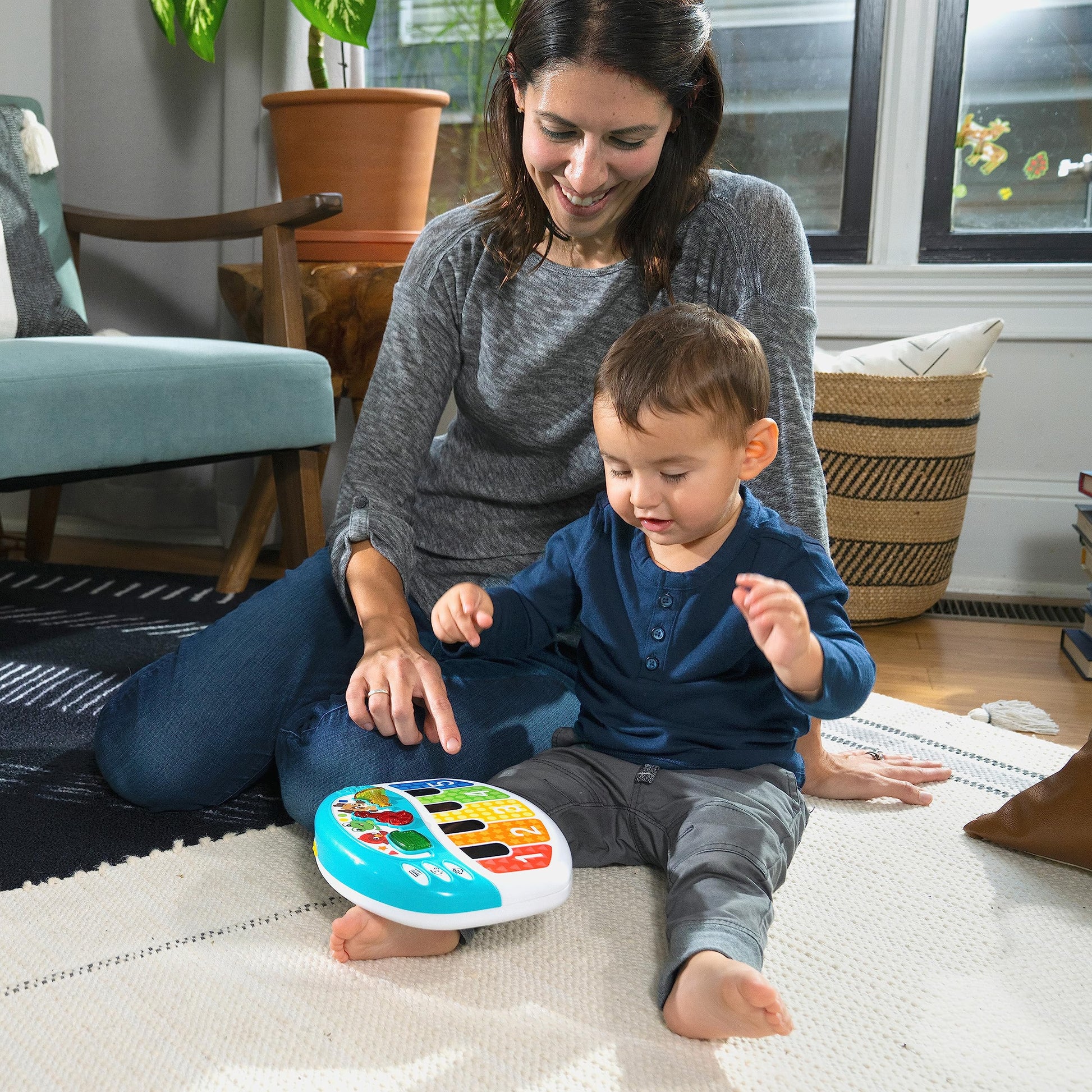 Baby Einstein Discover & Play Piano toy for babies, featuring colorful keys, animal illustrations, and multilingual learning functions.