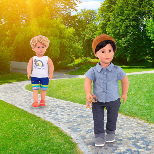 Our Generation Gabe boy doll holding a surfboard in cream, blue, and orange colors, ready for beach adventures.