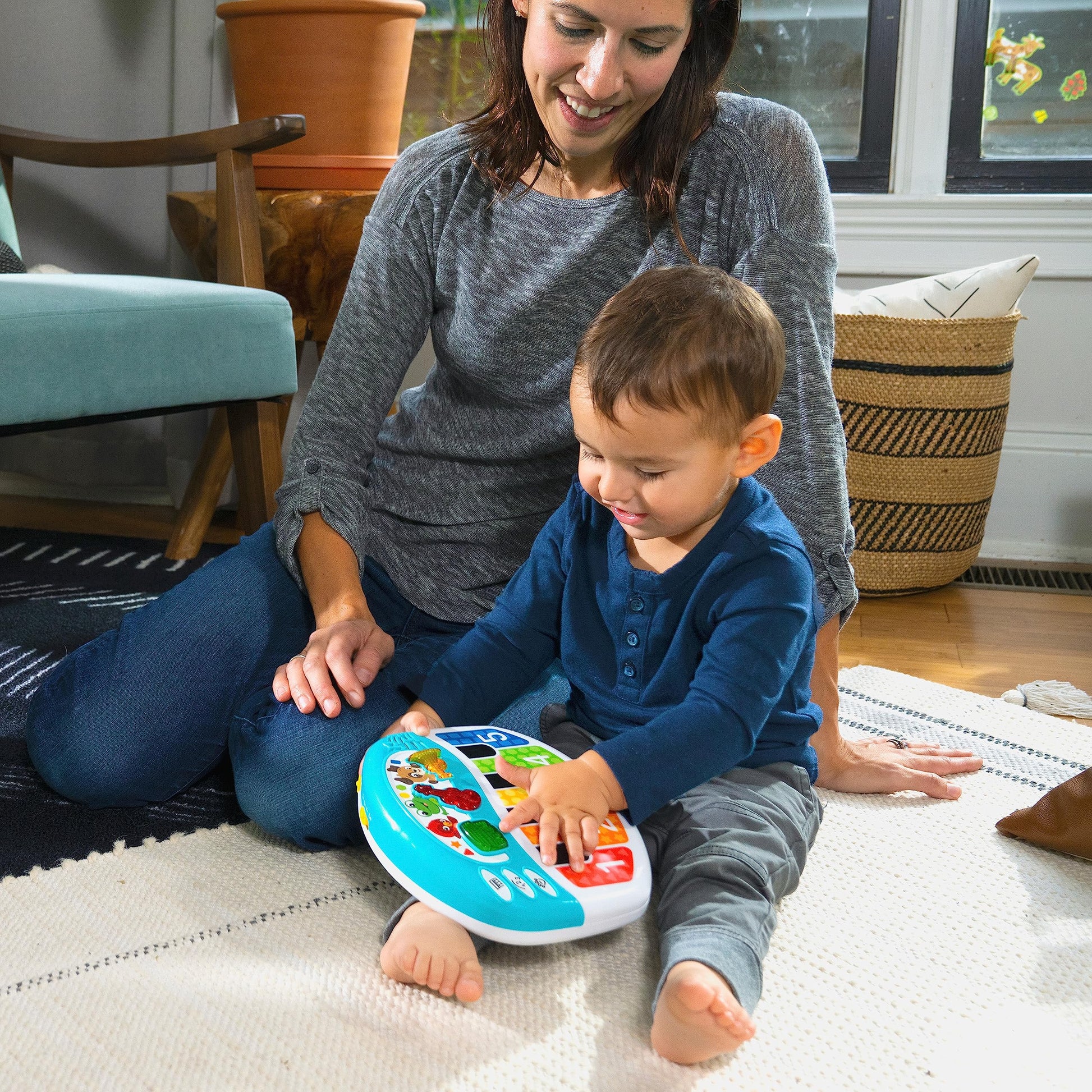 Baby Einstein Discover & Play Piano musical baby toy with colorful buttons and animal images for early learning and entertainment.